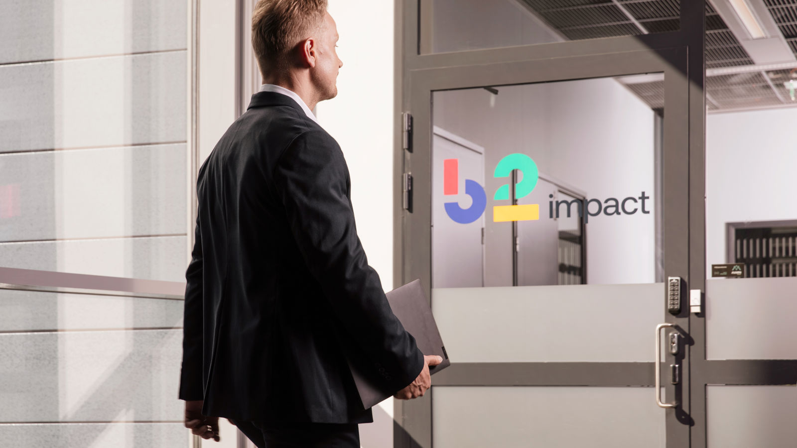 Man walking in an office corridor